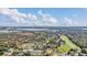 A scenic aerial view showcasing the neighborhood with a body of water and a highway in the background at 7325 Burnway Dr, Orlando, FL 32819
