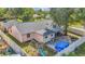 A backyard with a playset, above ground pool and an outdoor cooking area at 7325 Burnway Dr, Orlando, FL 32819