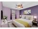 Bedroom featuring gray wood-look floors, with a ceiling fan, and modern decorations at 7325 Burnway Dr, Orlando, FL 32819
