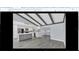 Contemporary kitchen features an island with seating and stainless steel appliances at 7325 Burnway Dr, Orlando, FL 32819