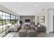Bright and airy living room showcasing a large window, modern furniture, and neutral decor for comfortable living at 7325 Burnway Dr, Orlando, FL 32819