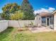 Landscaped backyard with mature trees and a cozy patio area at 734 Adidas Rd, Winter Springs, FL 32708