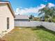 Spacious fenced backyard with lush green grass, ideal for outdoor activities and relaxation at 734 Adidas Rd, Winter Springs, FL 32708