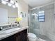 Modern bathroom featuring a sleek glass shower, granite countertop, and stylish finishes at 734 Adidas Rd, Winter Springs, FL 32708
