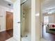 Bathroom with a step-in shower and doorway to the bedroom at 734 Adidas Rd, Winter Springs, FL 32708
