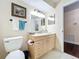 Well-maintained bathroom with a single sink vanity, a toilet, and a framed painting at 734 Adidas Rd, Winter Springs, FL 32708
