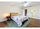 Cozy bedroom with a ceiling fan, wood floors, a walk-in closet, and a private bathroom at 734 Adidas Rd, Winter Springs, FL 32708