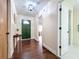Welcoming entryway with hardwood floors, stylish table, and access to a bathroom, creating a warm ambiance at 734 Adidas Rd, Winter Springs, FL 32708