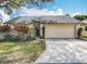 Charming single-story home with a well-maintained lawn and a two-car garage, offering curb appeal at 734 Adidas Rd, Winter Springs, FL 32708