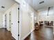 Bright hallway featuring hardwood floors and access to rooms, offering a glimpse of the home's layout at 734 Adidas Rd, Winter Springs, FL 32708