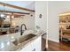 Beautiful kitchen with stainless appliances and granite countertops, open to the living and dining area at 734 Adidas Rd, Winter Springs, FL 32708