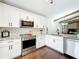Beautiful kitchen with stainless appliances and granite countertops, open to the living and dining area at 734 Adidas Rd, Winter Springs, FL 32708