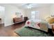 Bright main bedroom featuring a ceiling fan, wood floors, sliding door access to a patio, and furniture at 734 Adidas Rd, Winter Springs, FL 32708