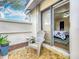 Private patio area with comfortable seating and a sliding door leading to the interior bedroom at 734 Adidas Rd, Winter Springs, FL 32708