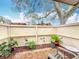 Cozy patio with brick flooring, privacy fence, and lush greenery, perfect for outdoor relaxation at 734 Adidas Rd, Winter Springs, FL 32708