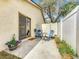Private patio area with stylish blue outdoor furniture, perfect for relaxing and enjoying the outdoors at 734 Adidas Rd, Winter Springs, FL 32708