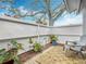 Cozy patio with brick flooring, privacy fence, and lush greenery, perfect for outdoor relaxation at 734 Adidas Rd, Winter Springs, FL 32708