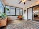 Sun room with bright lighting, tile floors, and decorative plants, with furniture and vintage mirrors at 734 Adidas Rd, Winter Springs, FL 32708