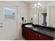 Bathroom with a large vanity and natural light coming through the window at 877 Scrub Jay Way, Davenport, FL 33896