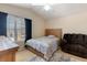 Bedroom featuring carpeting, vaulted ceilings, and plenty of natural light at 877 Scrub Jay Way, Davenport, FL 33896