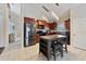 Well-lit kitchen featuring stainless steel appliances, central island and eat-in breakfast bar at 877 Scrub Jay Way, Davenport, FL 33896