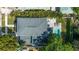 Aerial view of a home showcasing its layout, backyard pool, landscaping, and neighborhood at 900 Golfview St, Orlando, FL 32804