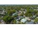 Aerial view of a lush, green residential neighborhood with well-maintained homes and mature trees at 900 Golfview St, Orlando, FL 32804