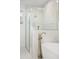 Modern bathroom featuring a soaking tub with gold fixtures and a separate glass enclosed shower at 900 Golfview St, Orlando, FL 32804