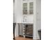 Bright butlers pantry with white cabinetry, stainless steel appliances, and glass storage at 900 Golfview St, Orlando, FL 32804