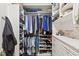 Well-organized walk-in closet with custom shelving, hanging rods, and drawers for optimal storage space at 900 Golfview St, Orlando, FL 32804