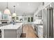 Bright, open kitchen featuring stainless steel appliances, large island and an open view to the living room and back yard at 900 Golfview St, Orlando, FL 32804