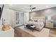 Bright main bedroom with decorative wallpaper and french doors to patio at 900 Golfview St, Orlando, FL 32804