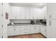 Spacious pantry with ample white cabinetry, countertop space, and hardwood floors at 900 Golfview St, Orlando, FL 32804