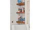 Close-up of floating shelves displaying books and decorative items, adding character to the room at 900 Golfview St, Orlando, FL 32804