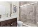 Modern bathroom boasts a walk-in shower, sleek vanity, and contemporary finishes at 10078 Greenshire Way, Orlando, FL 32827