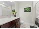 The bathroom features a modern vanity with a white countertop, tile flooring, and a decorative shower curtain at 10078 Greenshire Way, Orlando, FL 32827