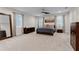 The spacious bedroom is a tranquil retreat featuring neutral tones, plush carpeting, and ample natural light at 10078 Greenshire Way, Orlando, FL 32827