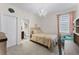 This charming bedroom includes an ensuite bathroom, a desk, and a cozy bed, perfect for relaxation at 10078 Greenshire Way, Orlando, FL 32827