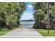 Lake Nona Boat Ramp with a clear view of the water, framed by lush trees and vegetation at 10078 Greenshire Way, Orlando, FL 32827