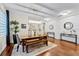 Stylish dining room with modern lighting and decor, perfect for gatherings and entertaining at 10078 Greenshire Way, Orlando, FL 32827