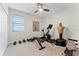 Stay active in this exercise room featuring a stationary bike, weights, and ample space for workouts at 10078 Greenshire Way, Orlando, FL 32827