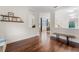 Open living space with hardwood floors, shelves, and lots of natural light at 10078 Greenshire Way, Orlando, FL 32827