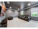 Enjoy movies in this theater room with comfortable seating, soft carpeting, and a large flat screen TV at 10078 Greenshire Way, Orlando, FL 32827