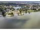 A beautiful aerial shot of a waterfront home and the surrounding area at 1070 Lake Ariana Blvd, Auburndale, FL 33823
