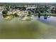 Scenic aerial image of a home nestled near the water, with a beautiful landscape at 1070 Lake Ariana Blvd, Auburndale, FL 33823
