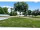 Backyard view showing a large tree and views of the lake at 1070 Lake Ariana Blvd, Auburndale, FL 33823