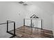 Bonus room overlooking lower floors features a high ceiling and modern cable railing at 1070 Lake Ariana Blvd, Auburndale, FL 33823