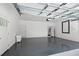 This garage has an epoxy floor, new door and access door to the main house at 1070 Lake Ariana Blvd, Auburndale, FL 33823