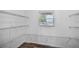 This walk-in closet has a window, wire shelving, and ample storage space at 1070 Lake Ariana Blvd, Auburndale, FL 33823