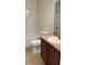 Bathroom with a vanity sink, a toilet, and a shower-tub combo at 10711 Yellow Tiger Lily Dr # S, Orlando, FL 32832